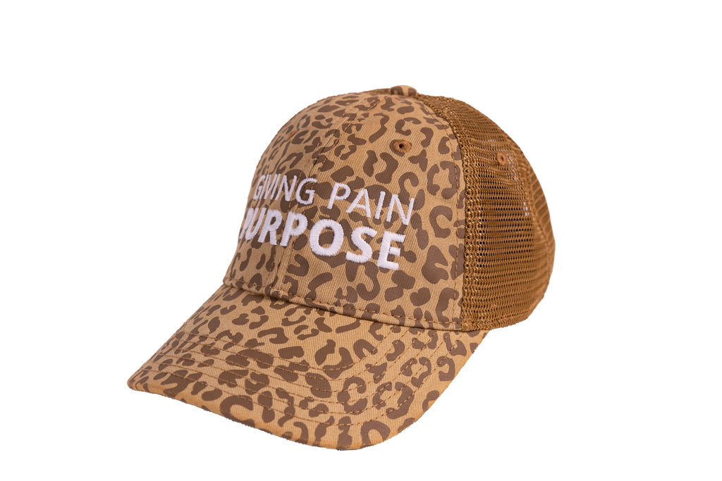 Leopard print cap with 'Giving Pain for Purpose' text on a white background