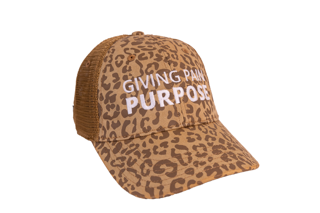 Leopard print cap with 'Giving Pain Purpose' text on a white background