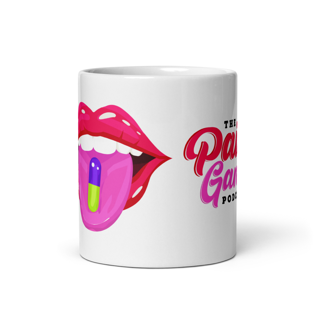 White ceramic The Pain Game Podcast mug with colorful lips logo, encouraging daily purpose and empowerment.