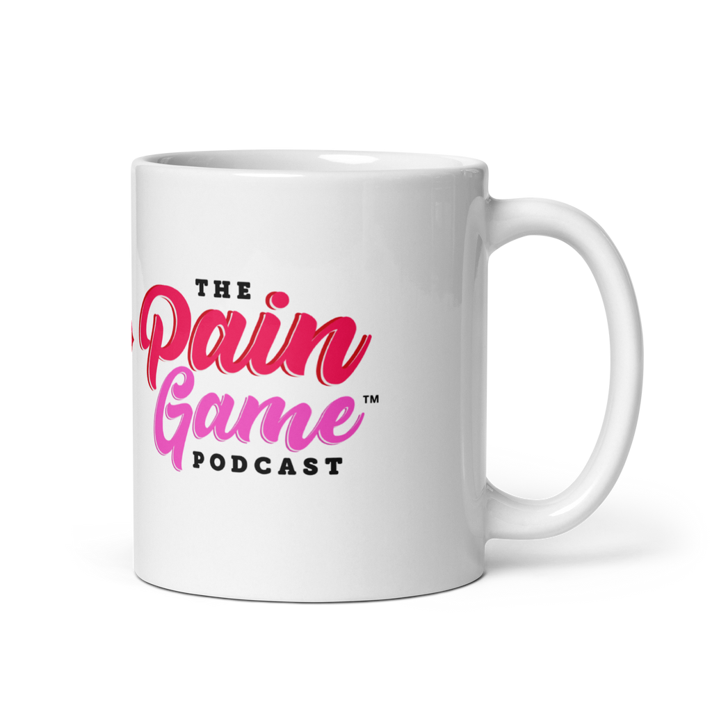 White ceramic The Pain Game Podcast mug with colorful lips logo, encouraging daily purpose and empowerment.